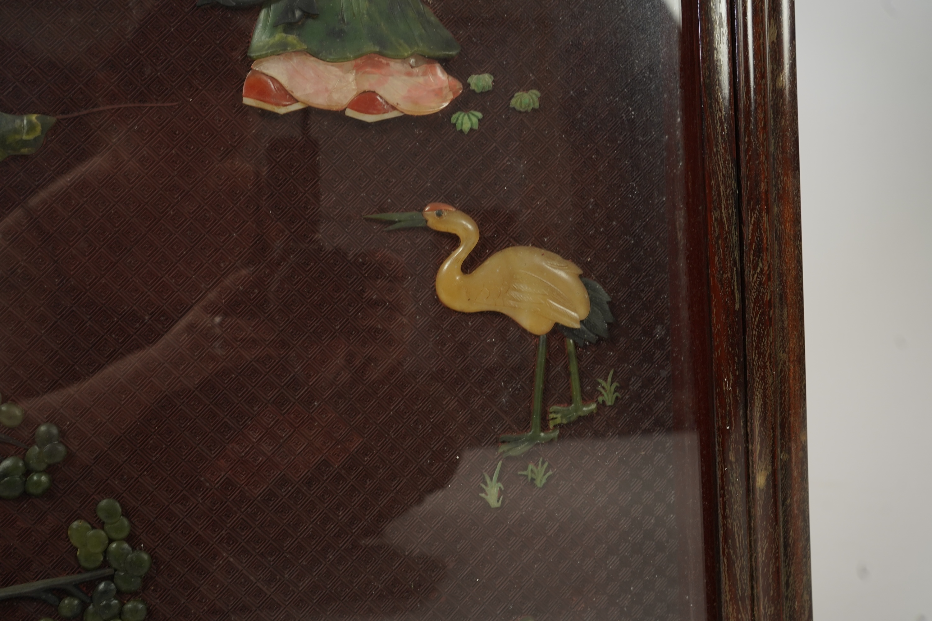 A Chinese carved cinnabar lacquer and hardstone mounted panel, early 20th century